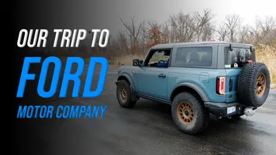 Two-door Ford Bronco on a wet lot in the SCS On The Road Our Trip to Ford episode
