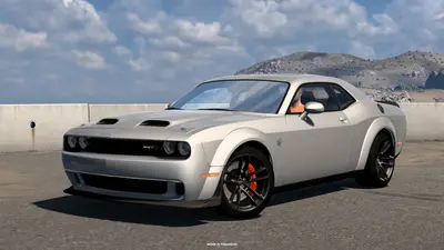 Silver 2023 Dodge Challenger SRT Hellcat Widebody parked by a concrete barrier in ATS Road Trip