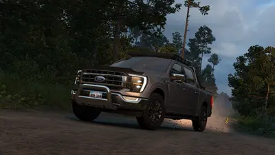Dark Ford F-150 with a bull bar on a forest road at dusk in ATS Road Trip