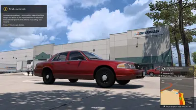 Red Ford Crown Victoria at a warehouse delivery point during a Road Trip courier job in American Truck Simulator